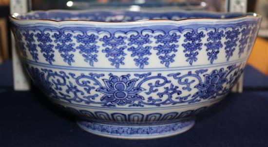 An unusual large Japanese Arita blue and white Kakiemon style bowl, Qianlong mark, 19th century, 30cm, hairline crack